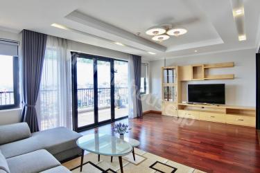 Large common living space in serviced apartment with windswept view of West Lake